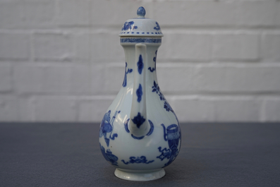 A Chinese blue and white ewer and cover with 'antiquities' design, Kangxi